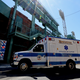 A convoy of 50 ambulances drives down Lansdowne Street on their way to Fenway Park in celebration of National EMS Week on May 20, 2020 in Boston, Massachusetts.